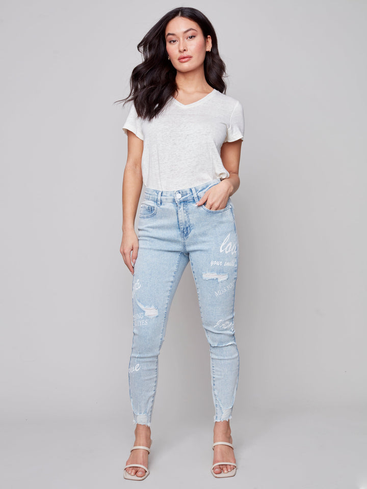 Mid Rise Distressed Skinny Jean